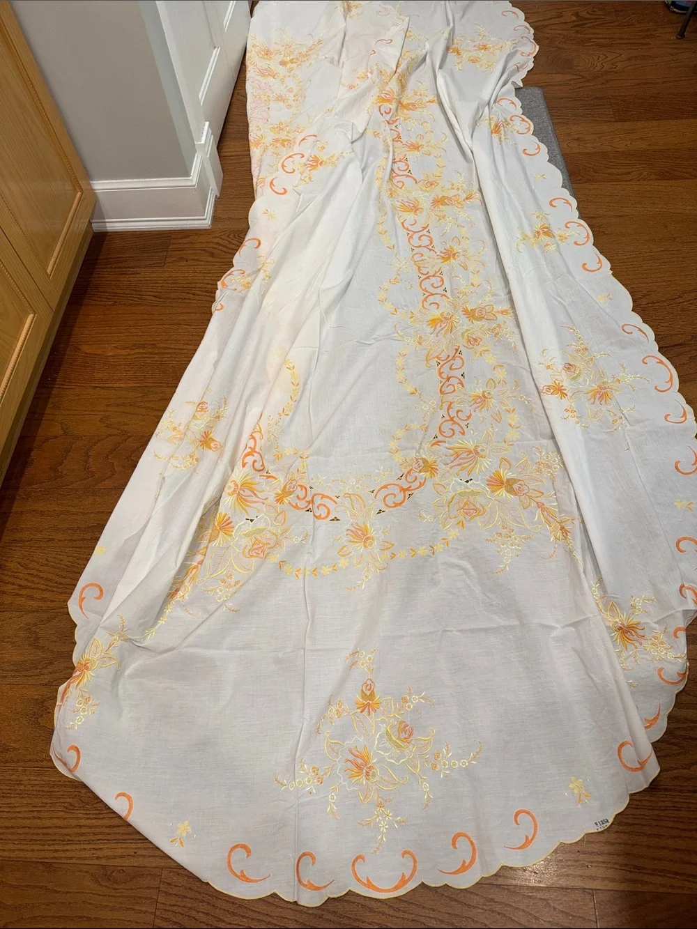 White vintage Tablecloth W/ Orange & Yellow Floral  Design. Size 114x64